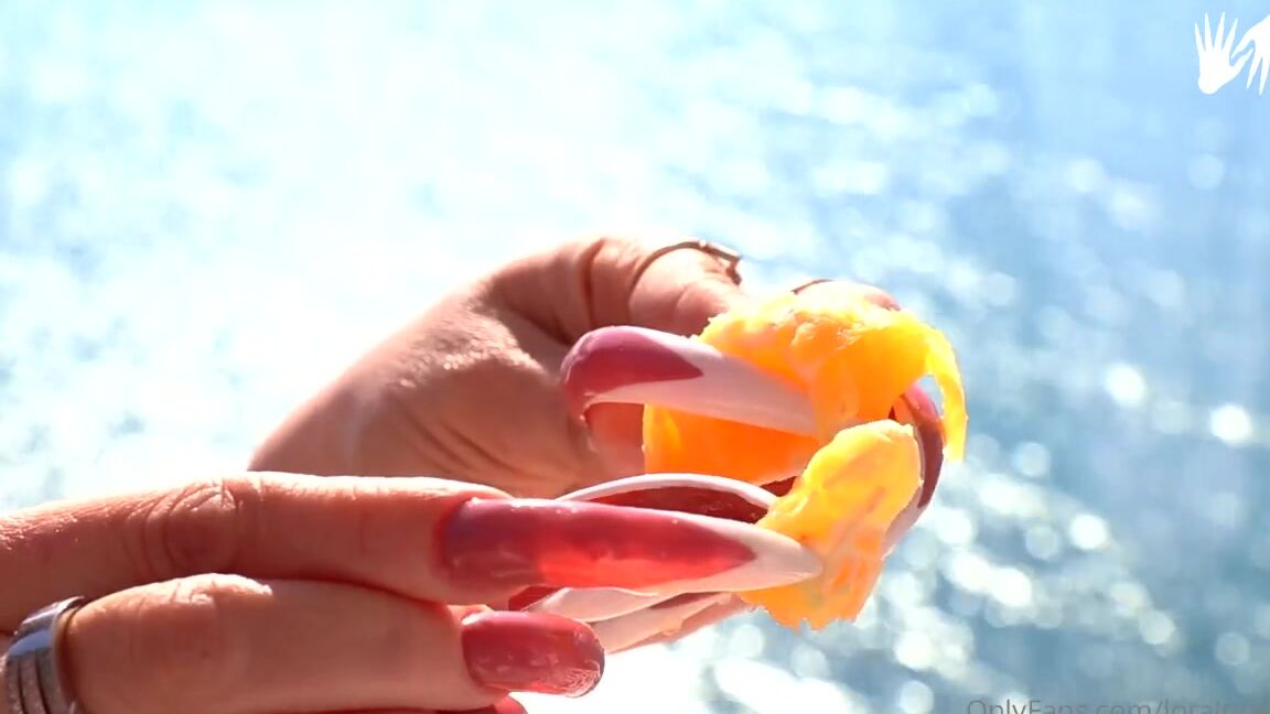 Lora Long Nails Nicknamed Loralongnails Onlyfans Crushing An Orange With Long Claws