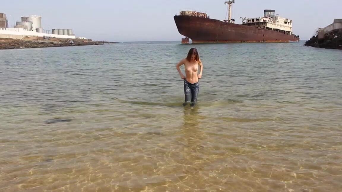 "ScarlotRose" clothes destruction / burning, public nudity, topless, wet & messy, wet look Denim Jeans in the sea manyvids