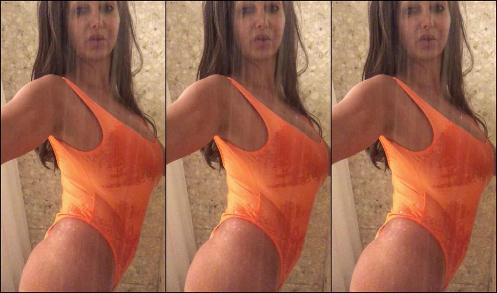 avaaddams-29-04-2018-9123218-itty-bitty-orange-one-piece-in-the-shower...