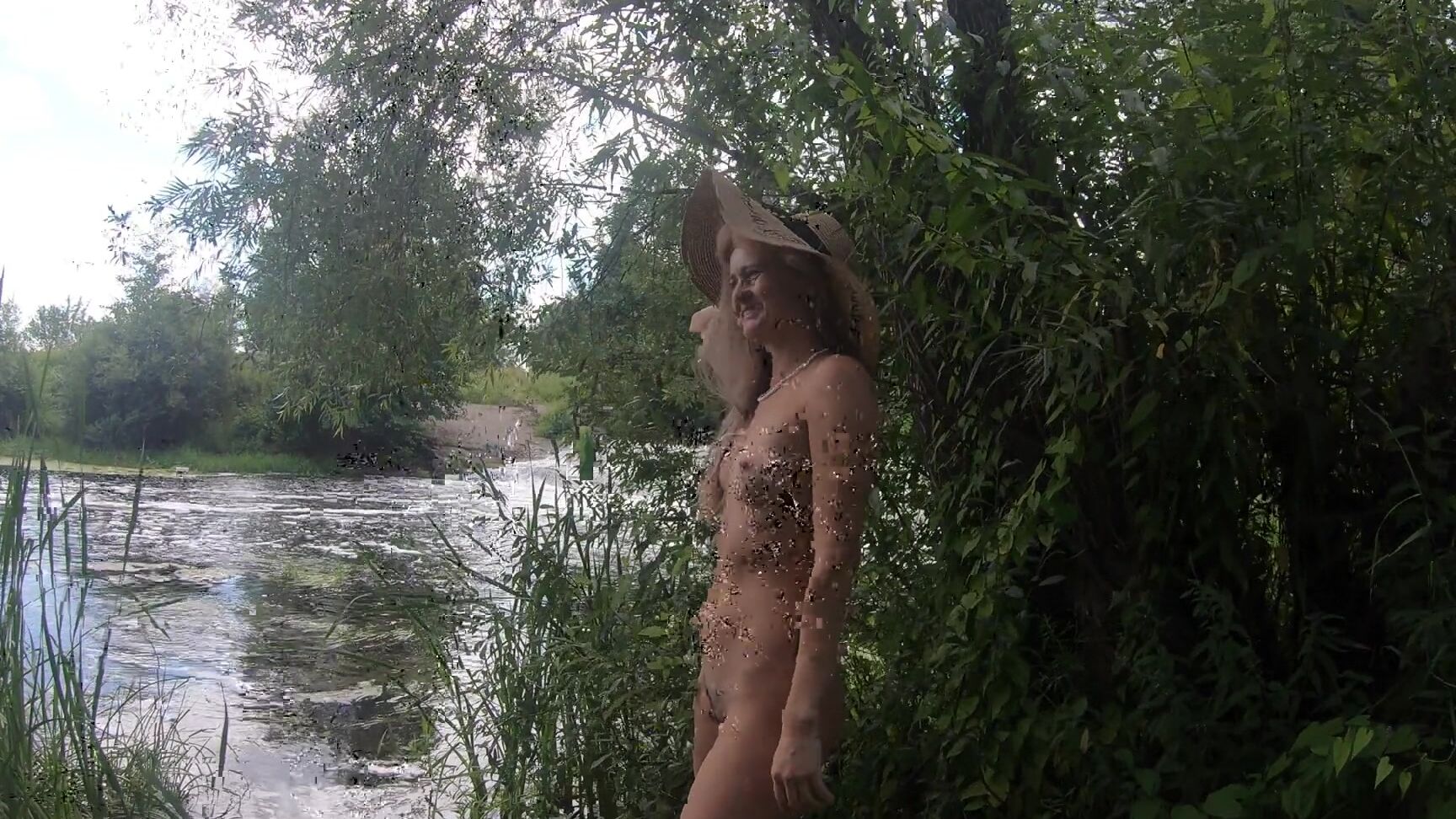Naked Girl Walks On A Waterfall Where People Relax
