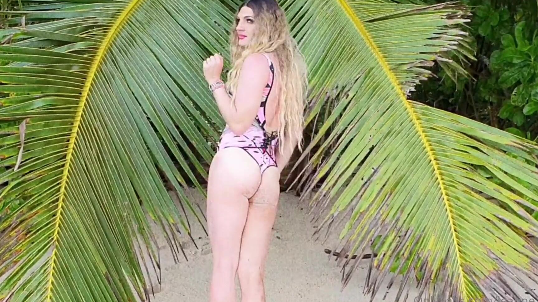Jeanne Pink On The Beach In A Swimsuit