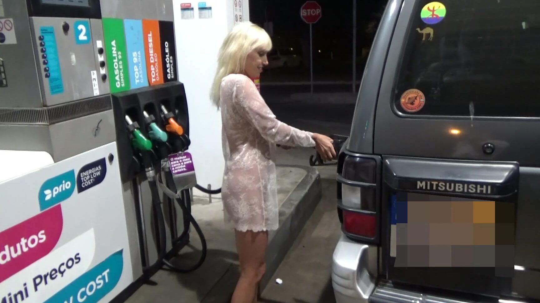 blonde-in-a-transparent-dress-fills-the-car-at-gas-station Pornhub