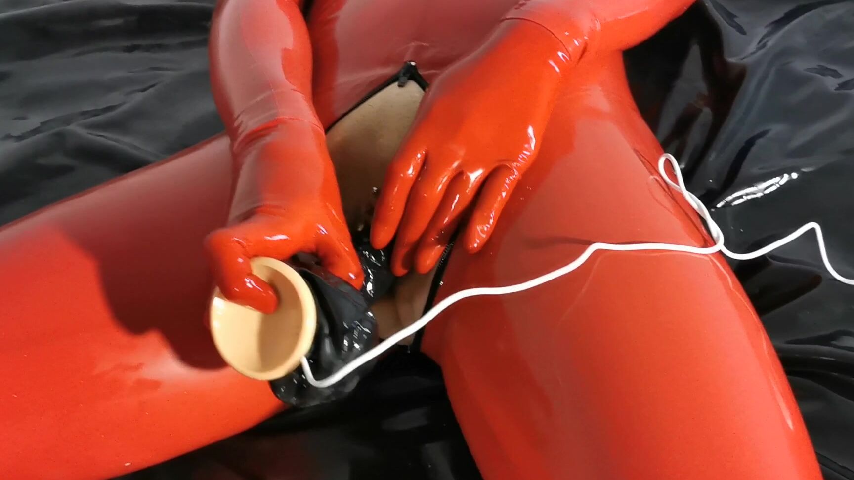Vickydevika New Dildo Red Catsuit And A Rubber Bed