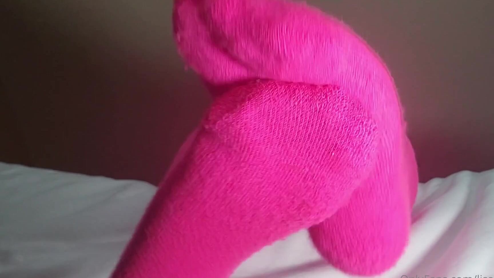 Lisa Asmr rubs her face in a sultry smirk while onlyfans video in socks