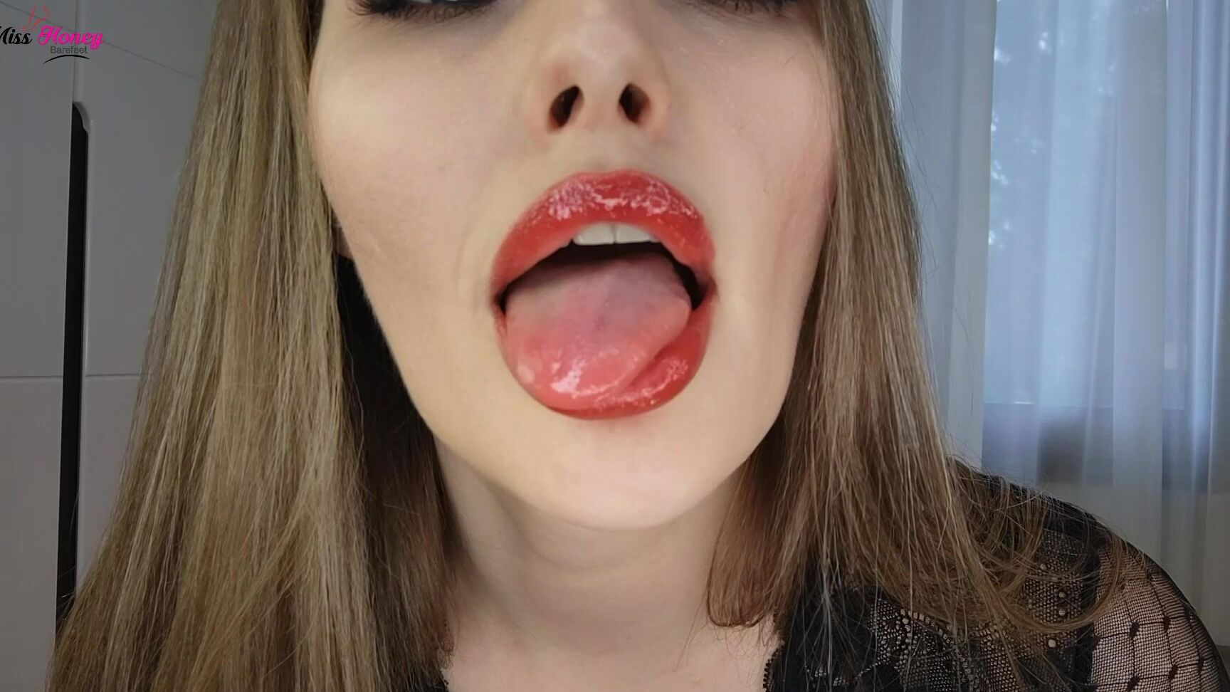 Honey Barefeet gives a sultry tease & worships her tongue with a lipstick fetish