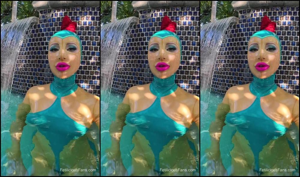 Miss Fetilicious gets a break from filming during a poolside shoot day